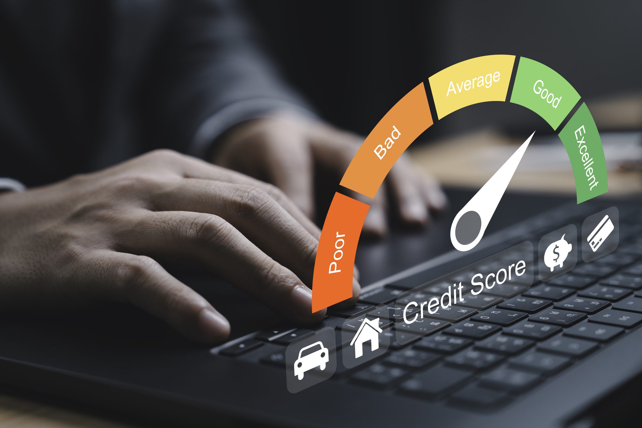 Hands typing with credit score gauge overlay.