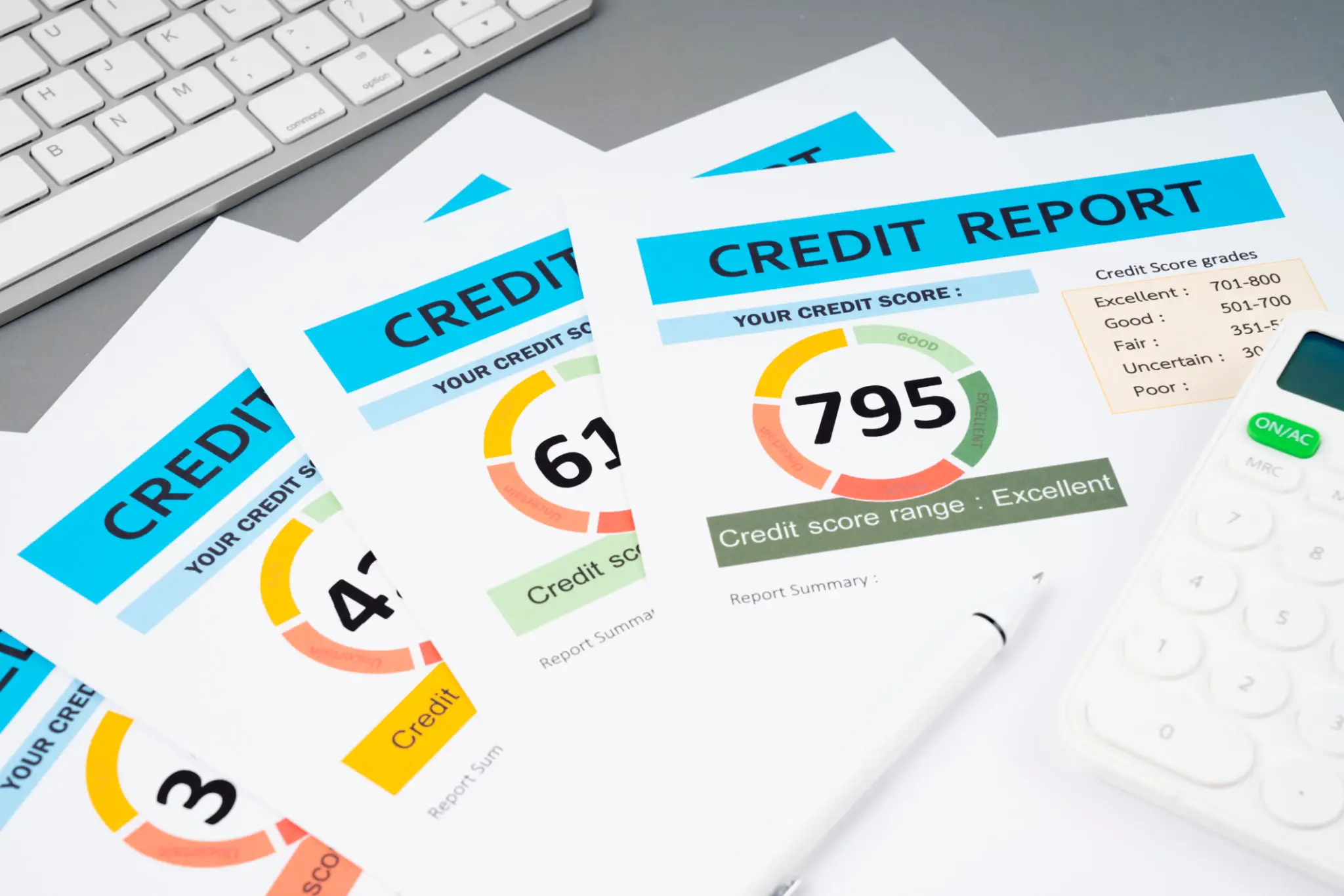 Close-up of credit report documents showing credit scores and ratings.